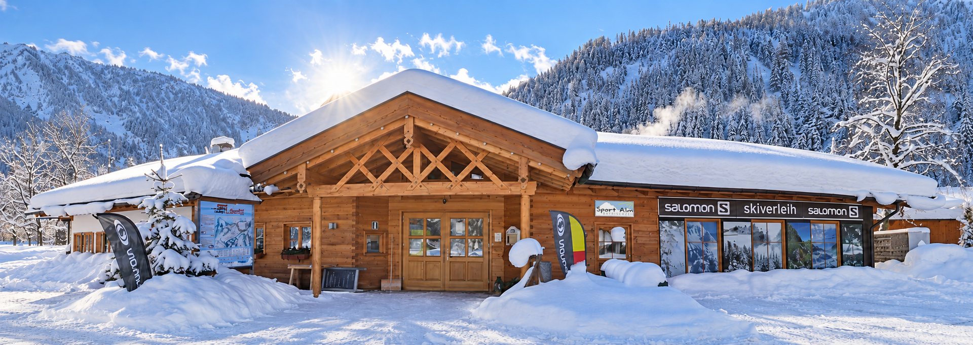 Die verschneite Sport Alm in Bayrischzell mit Salomon Skiverleih